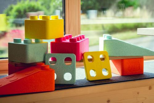 a group of lego blocks sitting on a window sill at Exklusive Cabins am Rursee inmitten der Natur – mlab relax Eifel in Simmerath