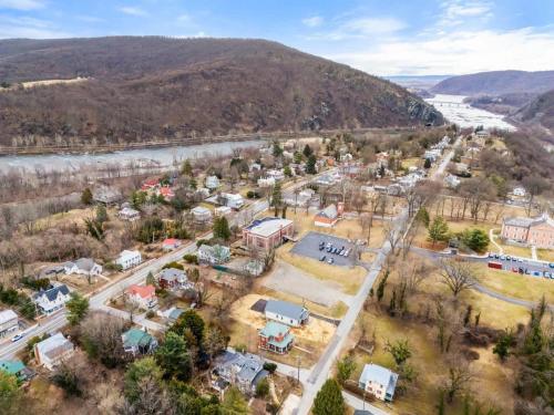 an aerial view of a small town next to a river at Historic Queen Anne Family Home w Modern Comforts in Harpers Ferry