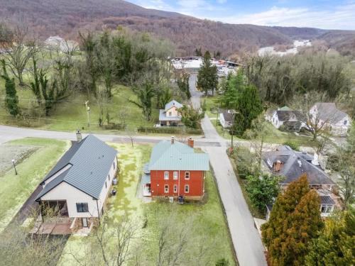 an aerial view of a home with a red house at Historic Queen Anne Family Home w Modern Comforts in Harpers Ferry