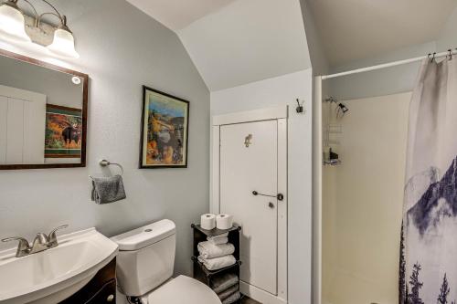 a bathroom with a white toilet and a sink at Cozy-Chic Condo with Mtn Views 3 Mi to Slopes! in Winter Park