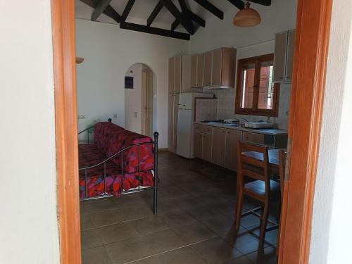 a kitchen with a table and a kitchen with a counter at Mikro Xorio in Vathi, Mani