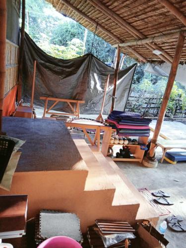 a room with a tent and chairs in it at PINOY YOGA POLE PIYOPO LA UNION fan kubo 4 pax in Rimus
