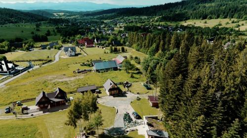 an aerial view of a small village in the mountains at Babiogórskie Domki in Lipnica Wielka