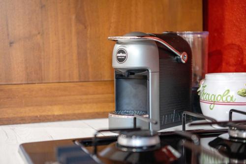 a toaster sitting on top of a stove at La Petite Maisonnette in Introd