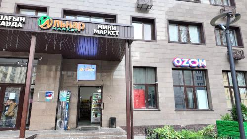 a building with a sign for a book store at Sholpan City in Almaty