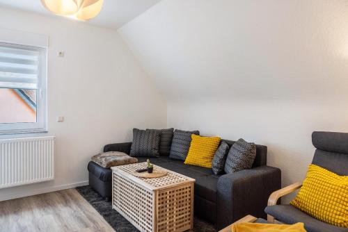 a living room with a couch and a table at Ferienwohnung Werratal in Barchfeld