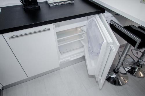 Η κουζίνα ή μικρή κουζίνα στο Luxury Studio Apartment White Sensation