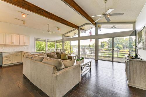 a living room with a couch and a tv at Launch and Dock Lake Norman Retreat with Scenic Deck in Mooresville