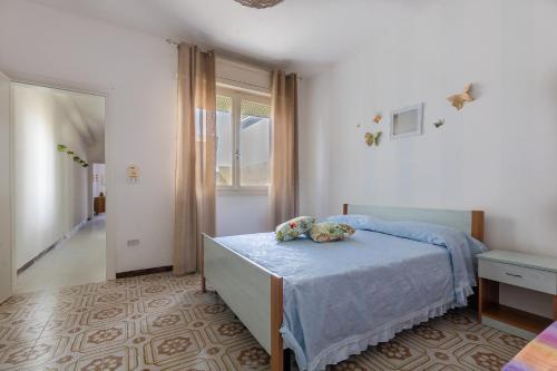 Postel nebo postele na pokoji v ubytování Appartamento Oscar Mancaversa