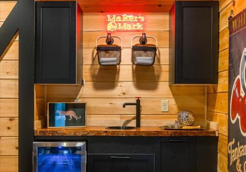 a kitchen with a sink and a counter top at Chic Designer Log Cabin Hot Tub Pool Tabledecks in McGaheysville
