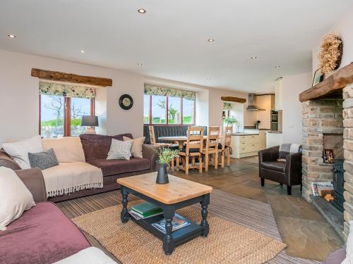 a living room with a couch and a table at Paradise in Gisburn