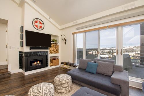 a living room with a couch and a fireplace at Crestview Place Unit 507 in Winter Park