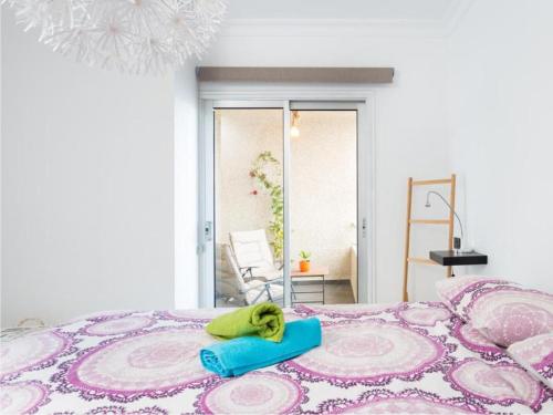 a bedroom with a bed with a towel on it at Live Tabaiba Maritime in Tabaiba