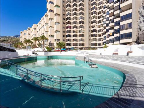 a swimming pool in front of a large building at Live Tabaiba Maritime in Tabaiba