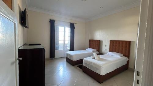 Katil atau katil-katil dalam bilik di Hotel Le Gardenia (ex Lutetia)