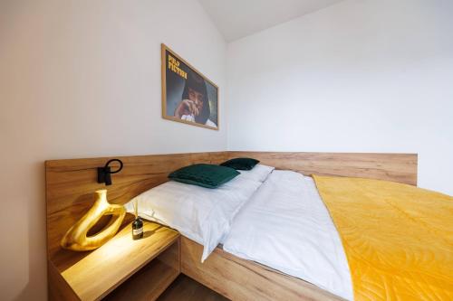 a bedroom with a bed with two bananas on it at Noble Inn Regency, City Centre, Free Parking by StayNest in Rzeszów