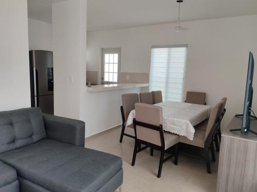 a living room with a table and a couch at Casa Relax Caucel 3 bedrooms in Caucel
