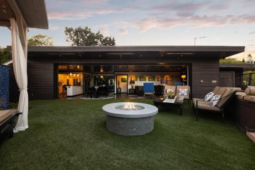 a house with a fire pit in the middle of a yard at New Listing Burbank Bungalow by Colby&Conrad in Los Angeles