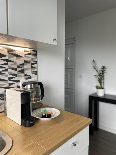 a kitchen with a plate of food on a counter at Charming hill view retreat in Funchal