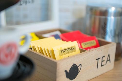a wooden box filled with different types of cheese at Casa Vacanze - Platamò in Platamona