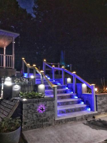 a set of stairs with blue lights at night at 597b) Large 4 bedroom - Pool - Fire Pit in Wolcott