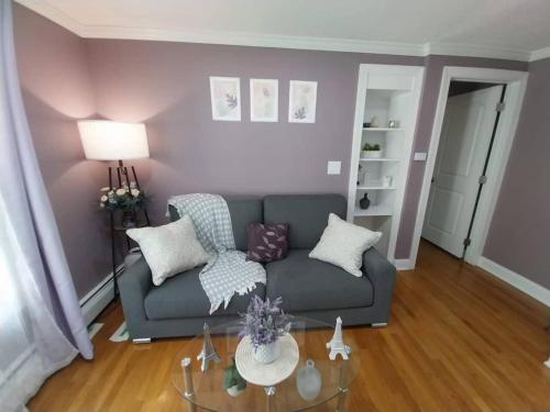 a living room with a couch and a table at 597b) Large 4 bedroom - Pool - Fire Pit in Wolcott
