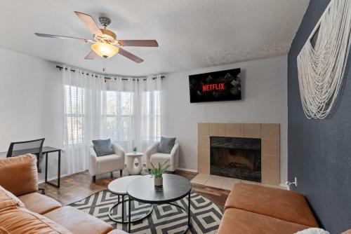 a living room with a couch and a fireplace at Lux Private Retreat - King Bed in Austin