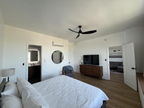 a bedroom with a bed and a ceiling fan at Retro-Chic Escape 208 in Klamath Falls