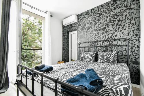 a bedroom with a bed with a zebra print wall at 2 Private Suits - Art, Location, Quiet, Balconies in Sofia