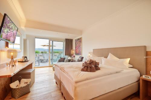 Ένα ή περισσότερα κρεβάτια σε δωμάτιο στο Hotel Villa Hügel