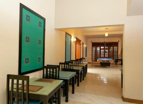 a row of tables and chairs in a restaurant at Sangrilla Bandarawela in Bandarawela