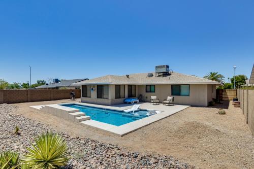 a house with a swimming pool in the yard at Golfers Oasis! 55 and Sun City West Retreat with Pool in Sun City West