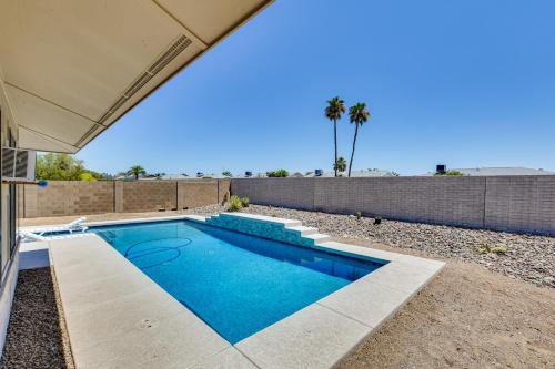 a swimming pool in the backyard of a house at Golfers Oasis! 55 and Sun City West Retreat with Pool in Sun City West