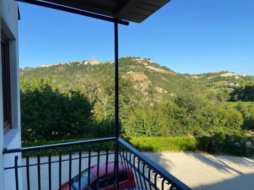 a balcony with a view of a mountain at La Casa del Falegname in Ripatransone