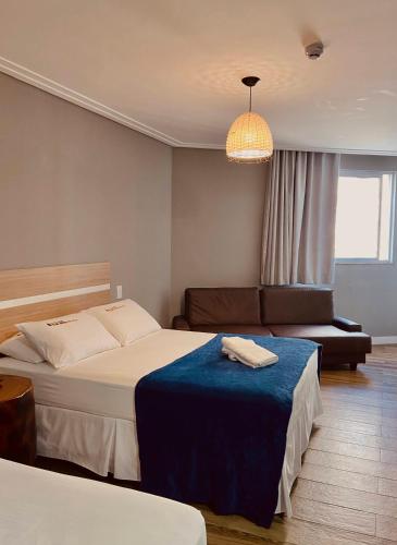 Кровать или кровати в номере Hotel Porto Salvador