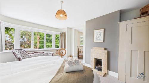 a bedroom with a bed and a fireplace at The Timbers in Seaview
