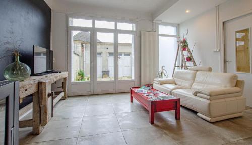 a living room with a couch and a coffee table at Le chaource in Chaource