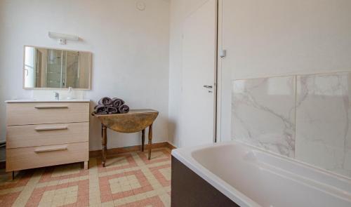 a bathroom with a sink and a bath tub at Le chaource in Chaource