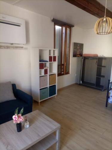 a living room with a couch and a coffee table at le sept 2 in Manosque