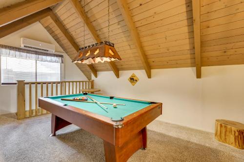 a pool table in a room with a ceiling at 2 Mi to Lake Arrowhead Pet-Friendly Cabin in Lake Arrowhead