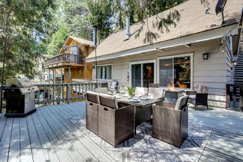 a patio with a table and chairs and a grill at 2 Mi to Lake Arrowhead Pet-Friendly Cabin in Lake Arrowhead