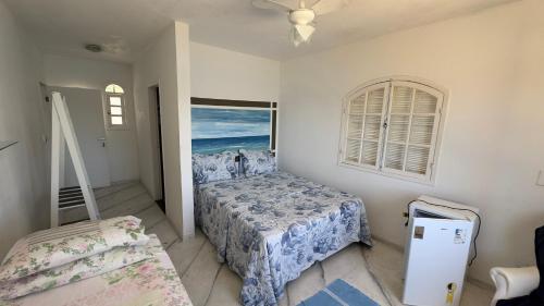 Giường trong phòng chung tại POUSADA lOUCURA MARINHA