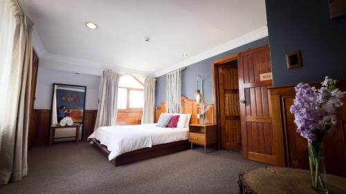 Een bed of bedden in een kamer bij Kintu Plaza Hospedaje