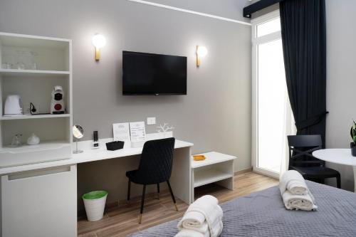 Ένα ή περισσότερα κρεβάτια σε δωμάτιο στο Dimora Neapolis