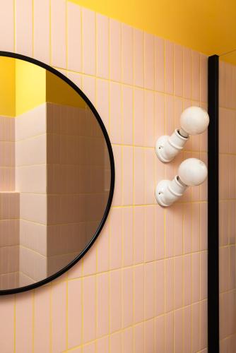 a mirror on the wall of a bathroom at In Piazza BnB in San Salvo