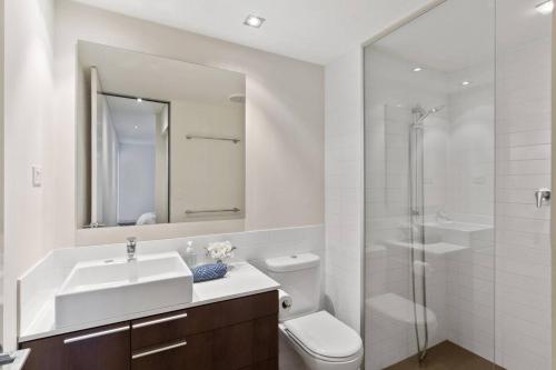 a bathroom with a sink and a toilet and a shower at Skylineviews 2bdrm River, Waca, Optus Stadium in Perth