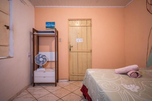 Ένα ή περισσότερα κρεβάτια σε δωμάτιο στο MANGAMEL Hostel Pousada