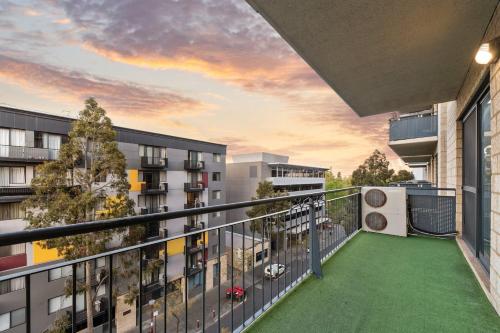 an apartment balcony with a soccer ball on it at Spacious 2 Bedroom Pool & Gym PerthCBD,Optus,WACA in Perth