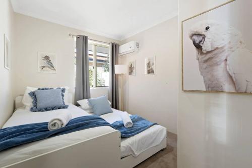 a bedroom with two beds and a window at Rivervale Family Retreat Quiet 3BR Home Near Swan in Perth