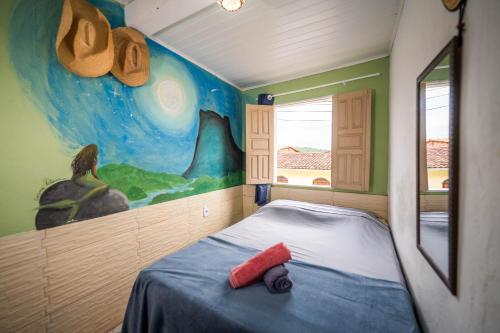 Ένα ή περισσότερα κρεβάτια σε δωμάτιο στο MANGAMEL Hostel Pousada